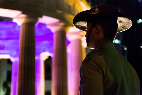 Young soldier standing at attention during the Anzac Day dawn service in Brisbane, 2014