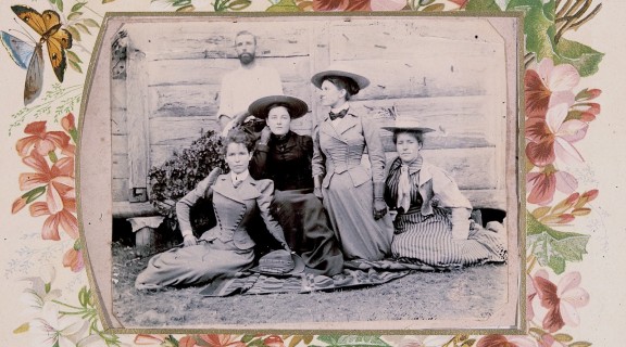 Black & white photo of a family featuring 4 women and one man.
