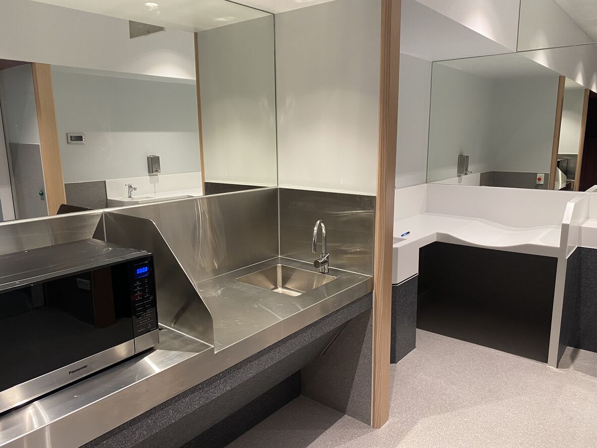 Parents room change table, sink and microwave